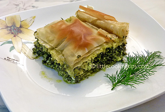 Traditional Greek pie with arugula, ricotta (anthotyros) and greens Traditional Greek pie with arugula, ricotta (anthotyros) and greens