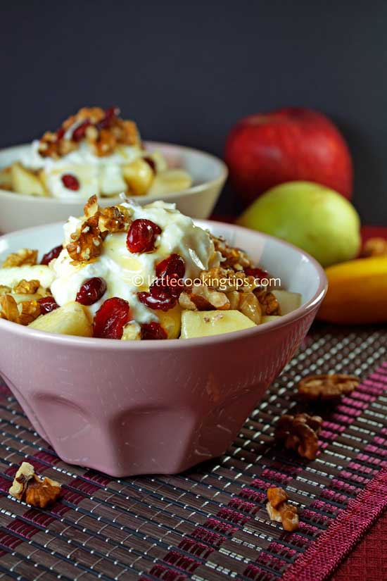 Delicious fruit salad with Greek yogurt and dried cranberries Delicious fruit salad with Greek yogurt and dried cranberries